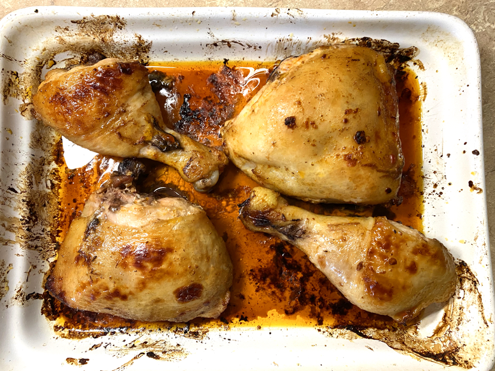 cooked chicken in a roasting dish